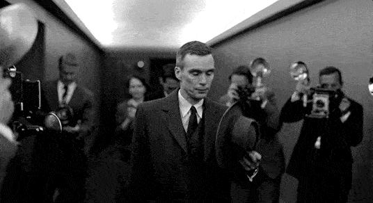 A short clip from oppenheimer with press flashing