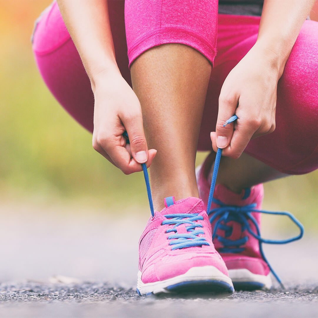 A woman trying on new running shoes