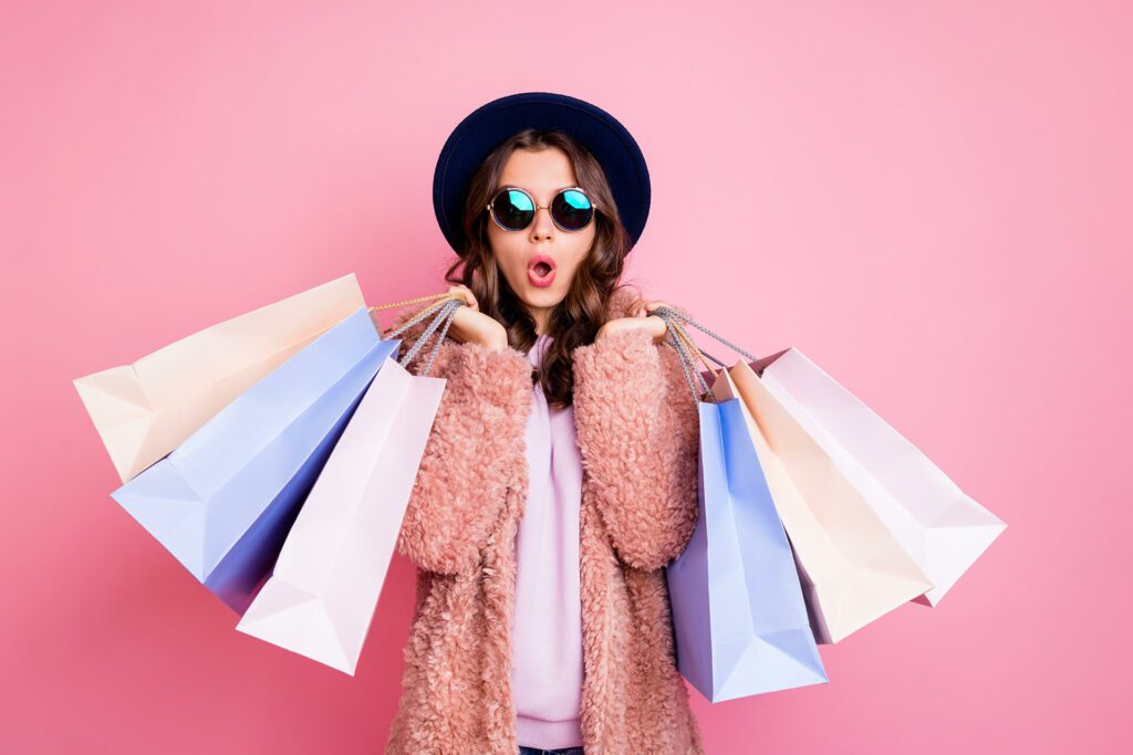 Photo of lady carrying many shopping bags
