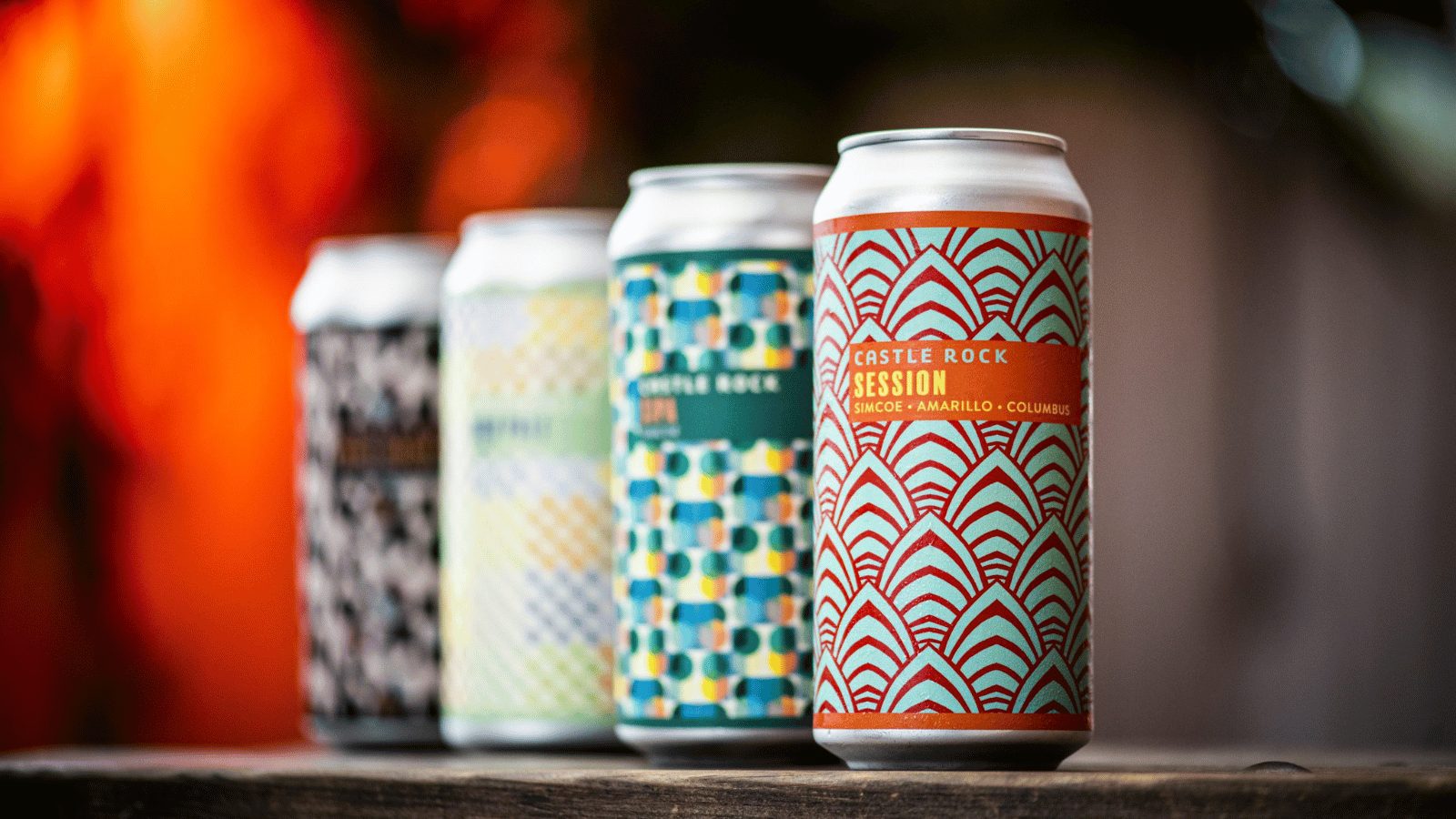 4 cans of castlerock beer in a row